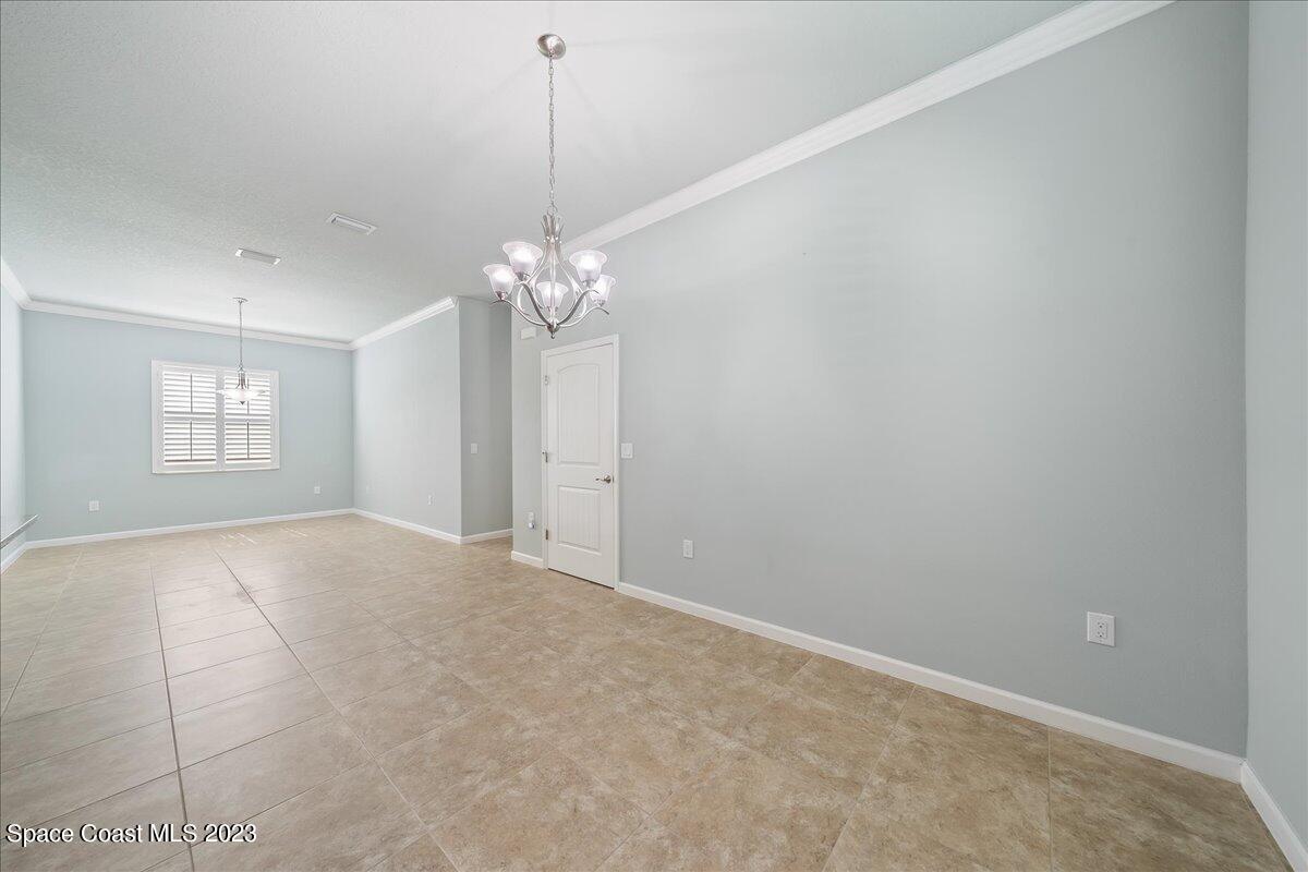 603 Heming Way Melbourne, FL 32901 - Photo 19 of 45 a view of an empty room with a window