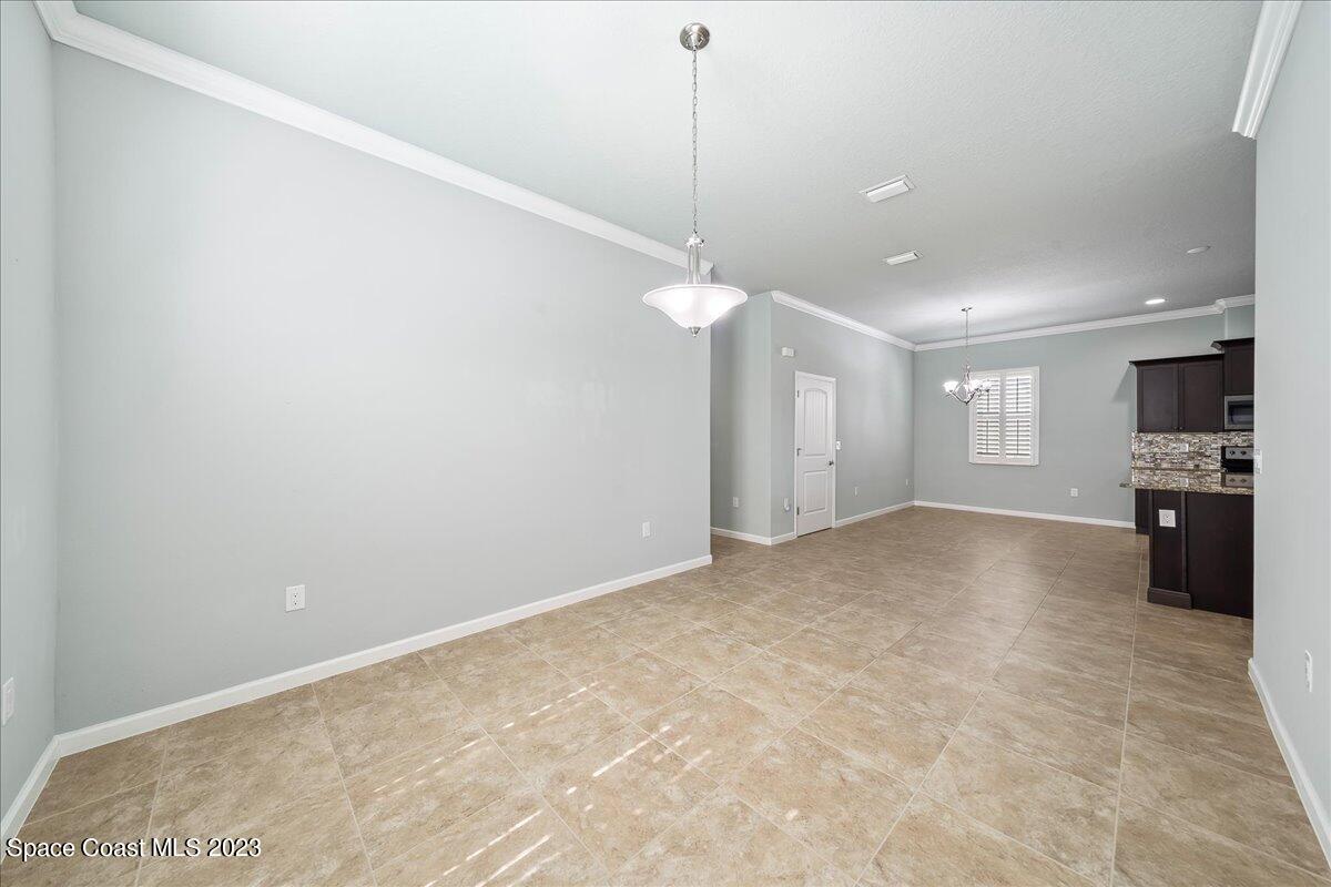 603 Heming Way Melbourne, FL 32901 - Photo 21 of 45 a view of a kitchen with a sink and a chandelier