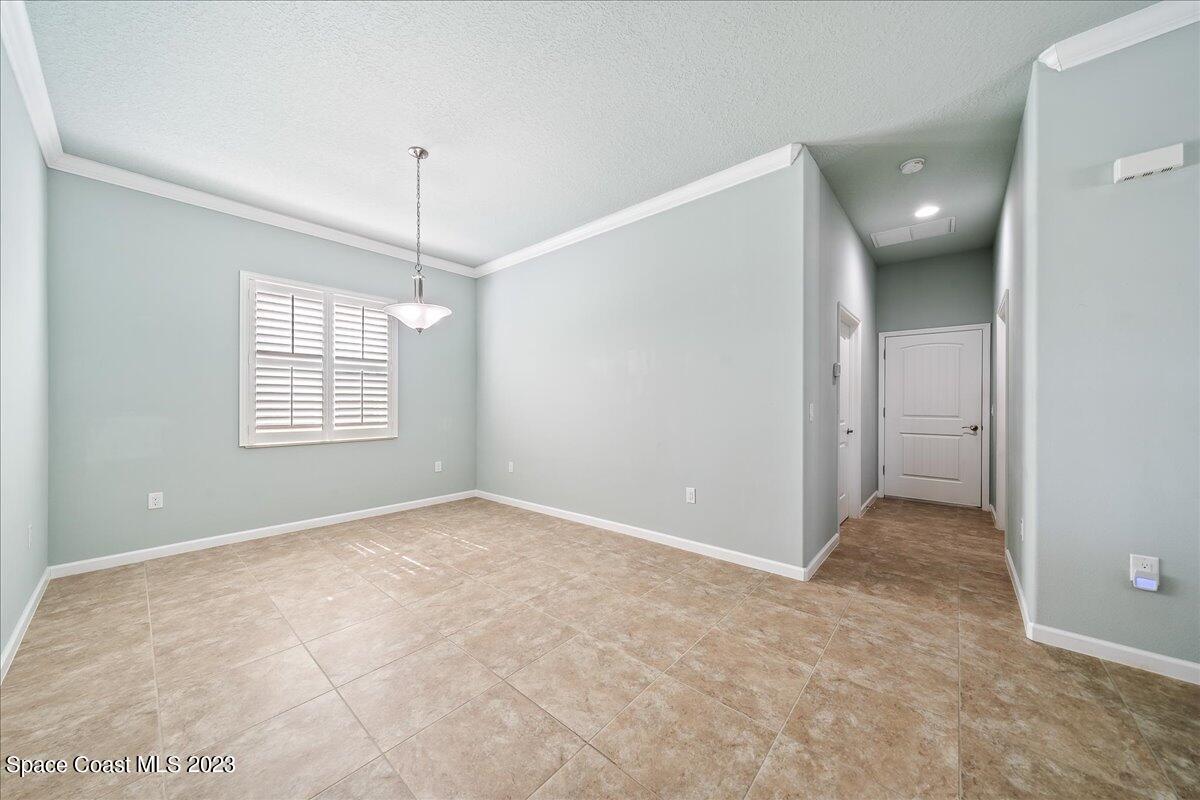 603 Heming Way Melbourne, FL 32901 - Photo 23 of 45 a view of an empty room with a window