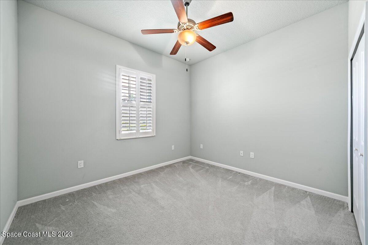 603 Heming Way Melbourne, FL 32901 - Photo 29 of 45 an empty room with windows and fan