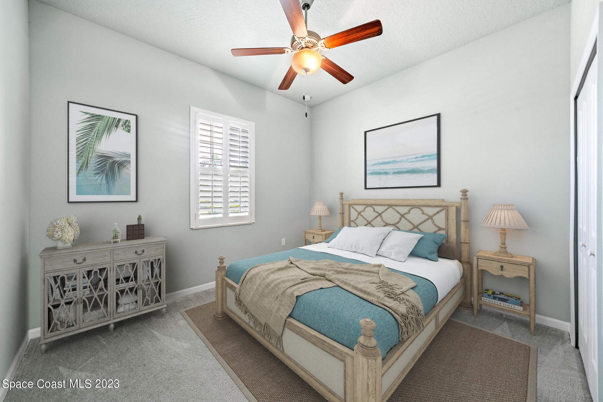 603 Heming Way Melbourne, FL 32901 - Photo 30 of 45 a bedroom with a bed a chandelier and a window