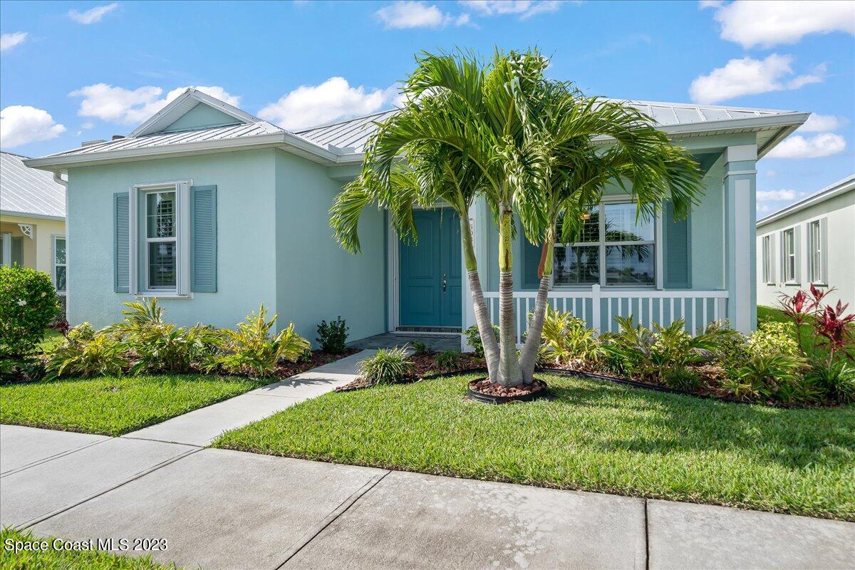 603 Heming Way Melbourne, FL 32901 - Photo 3 of 45 a front view of a house with garden
