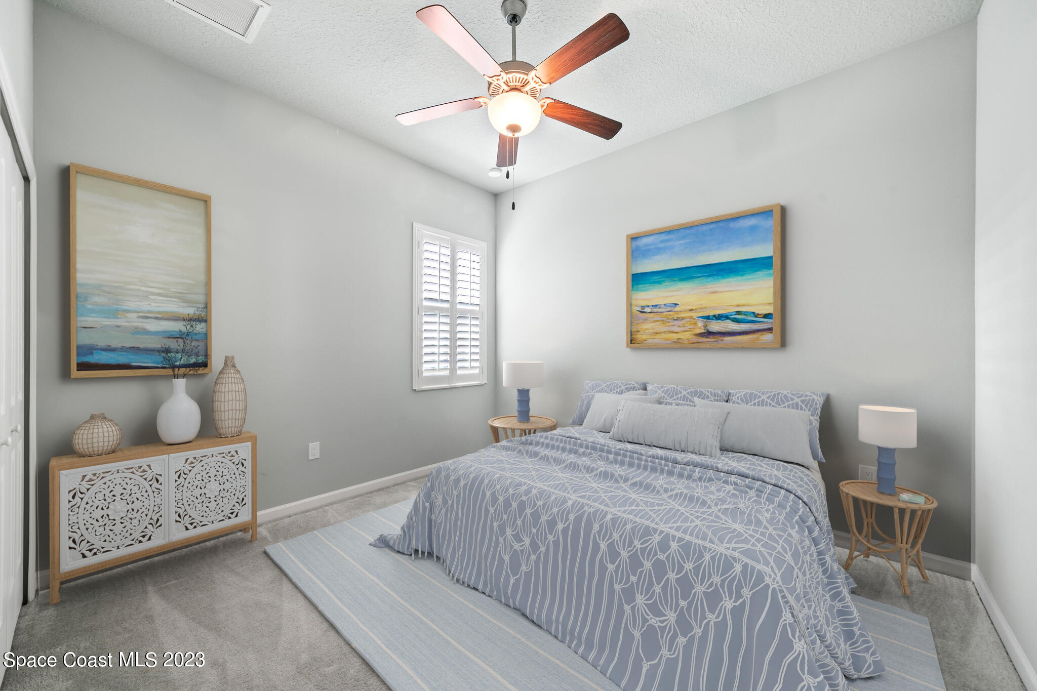 603 Heming Way Melbourne, FL 32901 - Photo 32 of 45 a bedroom with a bed and a couch