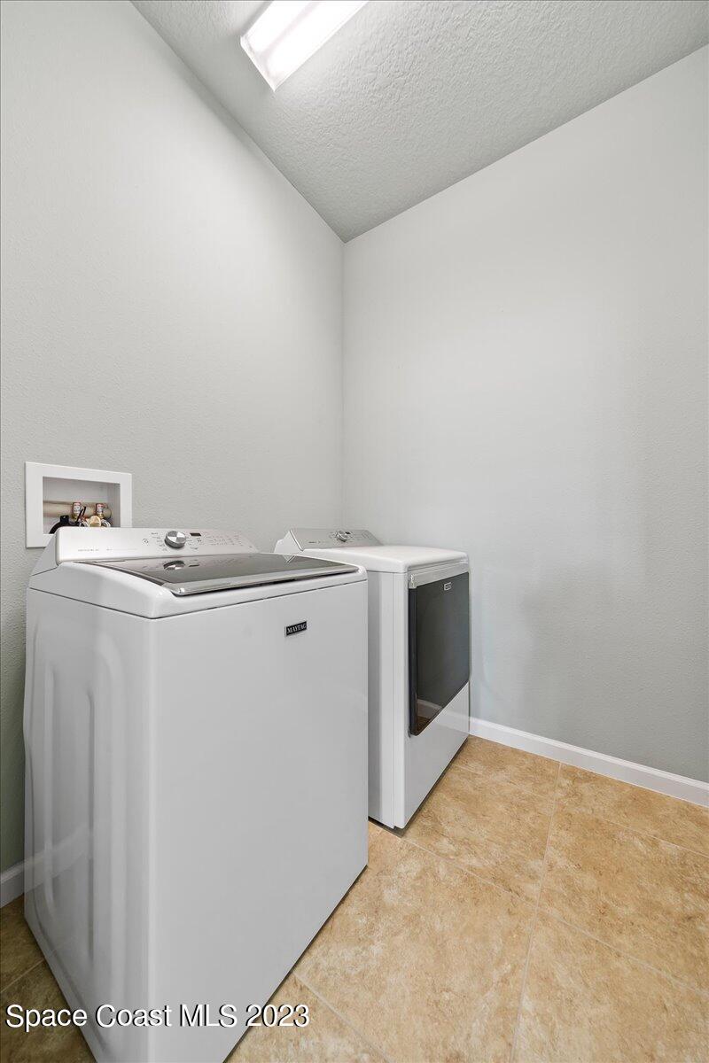 603 Heming Way Melbourne, FL 32901 - Photo 35 of 45 a utility room with dryer and washer
