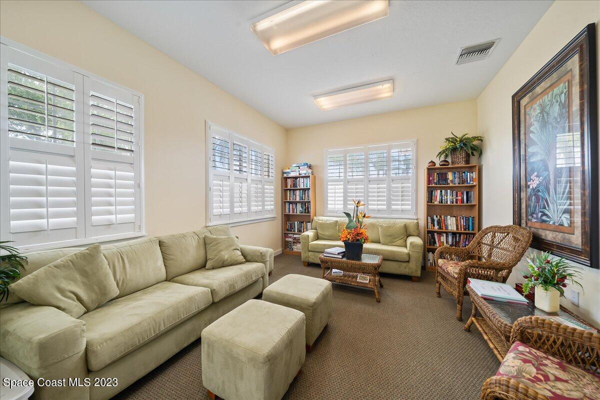 603 Heming Way Melbourne, FL 32901 - Photo 40 of 45 a living room with furniture and large windows