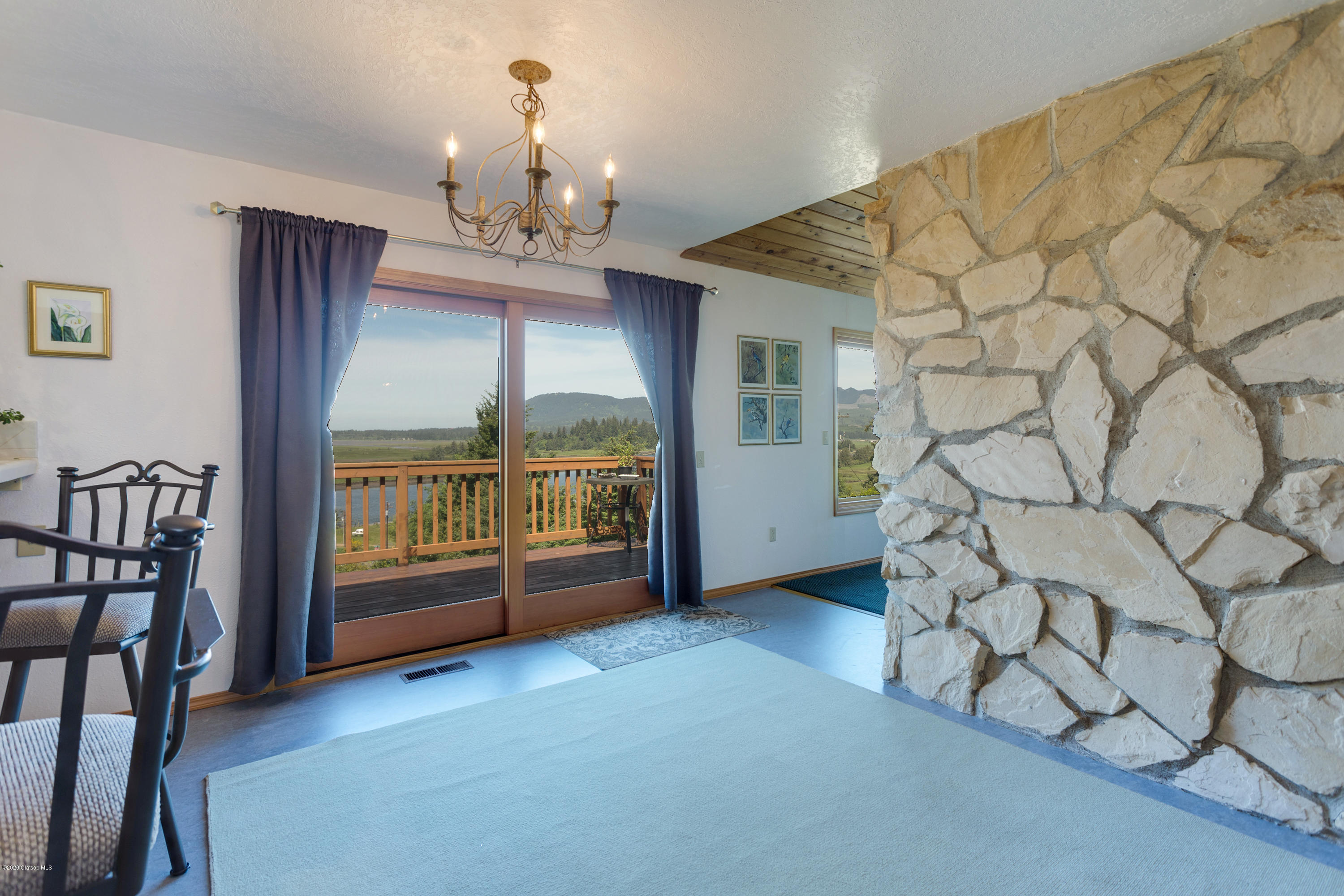 218 Spruce Street Wheeler, OR 97147 - Photo 5 of 18 dining/stone wall