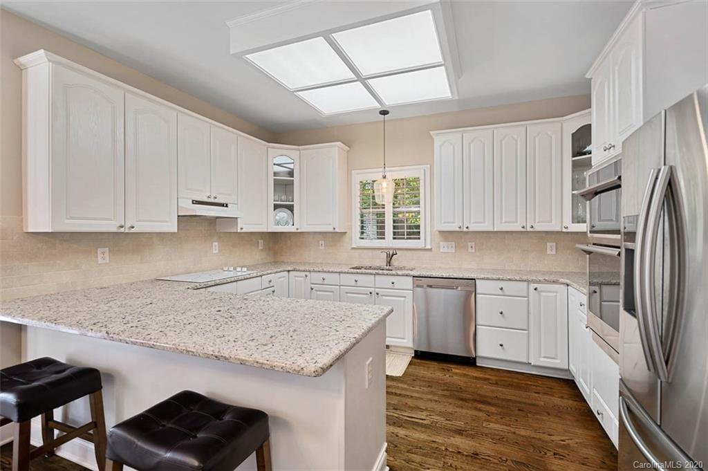 7915 Park Road Charlotte, NC 28210 - Photo 12 of 40 a kitchen with a sink stove and refrigerator