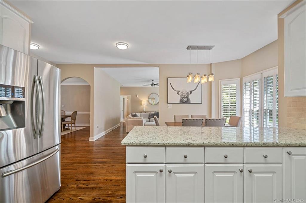 7915 Park Road Charlotte, NC 28210 - Photo 13 of 40 a kitchen with granite countertop a refrigerator a sink and dishwasher