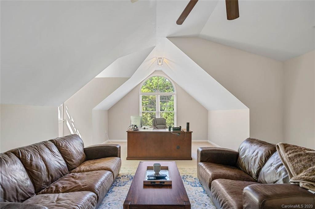7915 Park Road Charlotte, NC 28210 - Photo 21 of 40 a living room with furniture and a large window