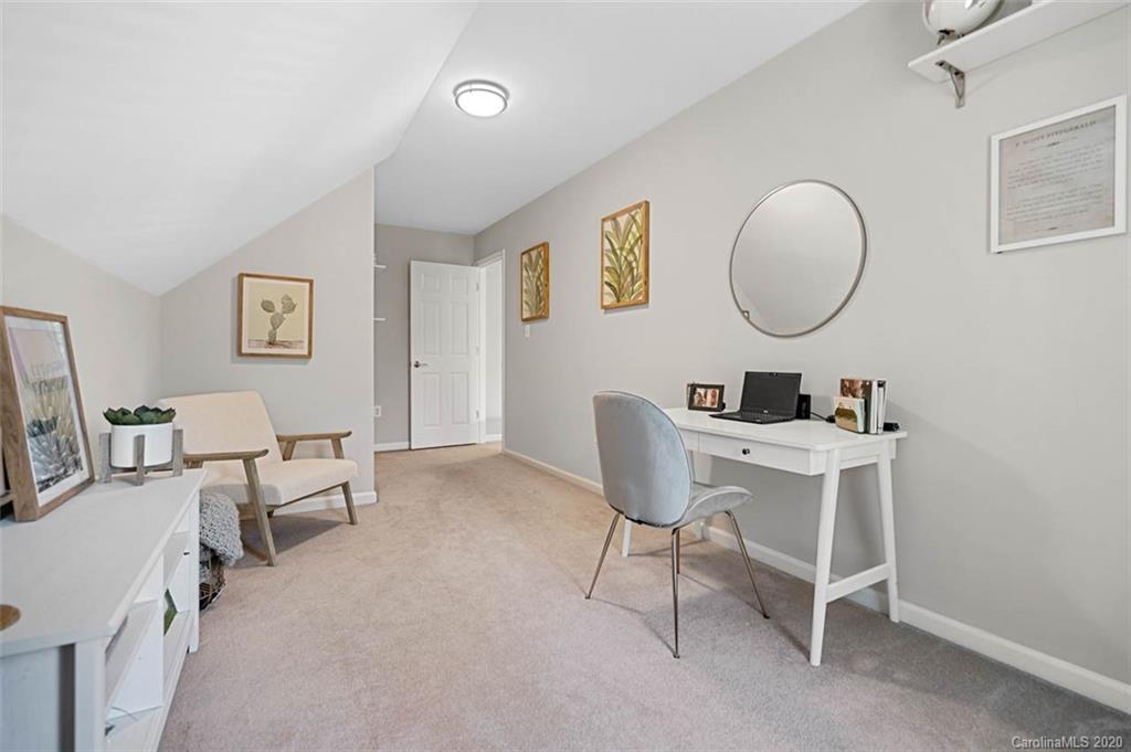 7915 Park Road Charlotte, NC 28210 - Photo 25 of 40 a work room with furniture and a mirror