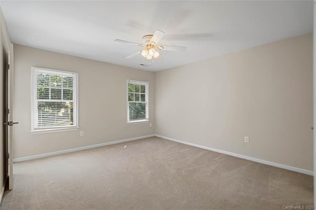 7915 Park Road Charlotte, NC 28210 - Photo 30 of 40 an empty room with a window and a fan