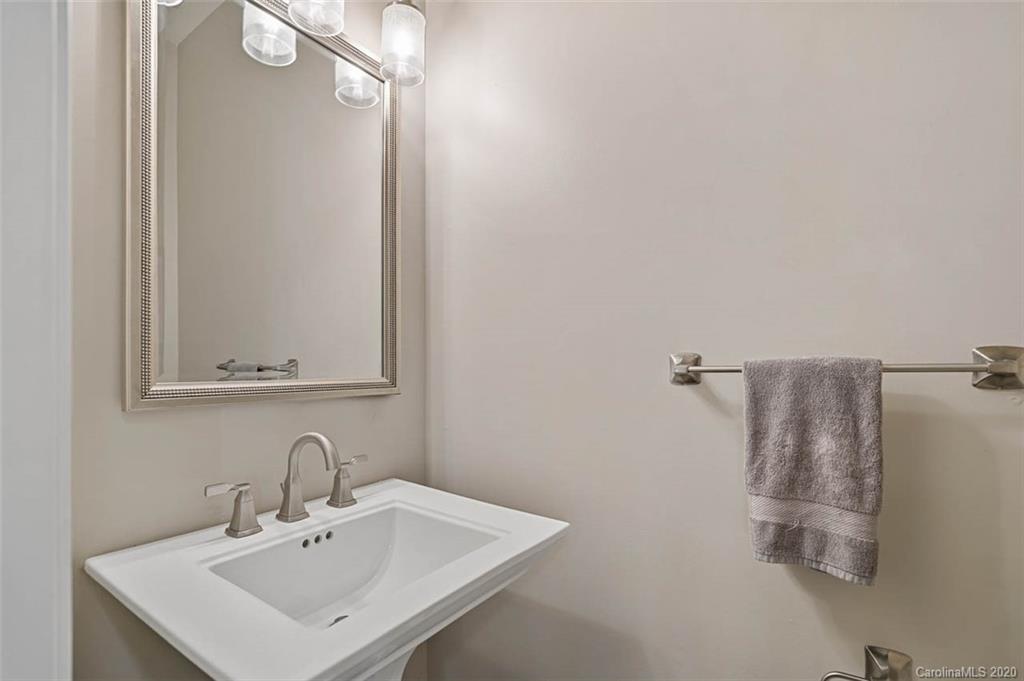 7915 Park Road Charlotte, NC 28210 - Photo 33 of 40 a bathroom with a sink and mirror