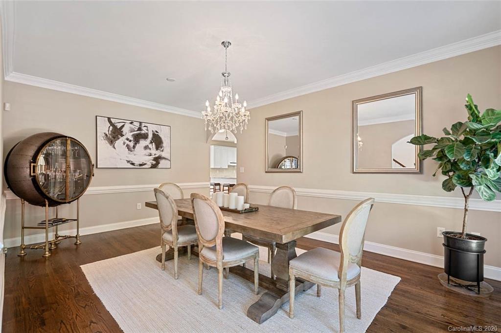 7915 Park Road Charlotte, NC 28210 - Photo 5 of 40 a view of a dining room with furniture wooden floor and chandelier