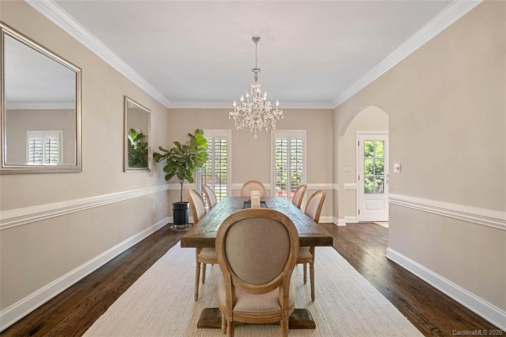 7915 Park Road Charlotte, NC 28210 - Photo 6 of 40 a view of a dining room with furniture window and wooden floor