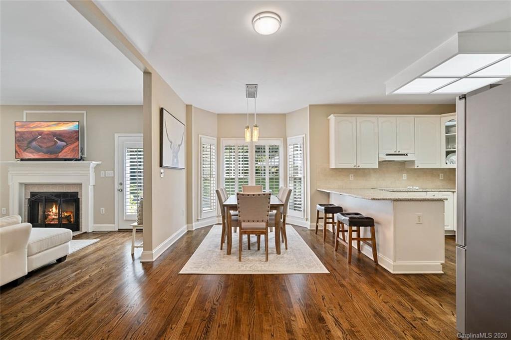 7915 Park Road Charlotte, NC 28210 - Photo 8 of 40 a view of a dining room with furniture window and wooden floor