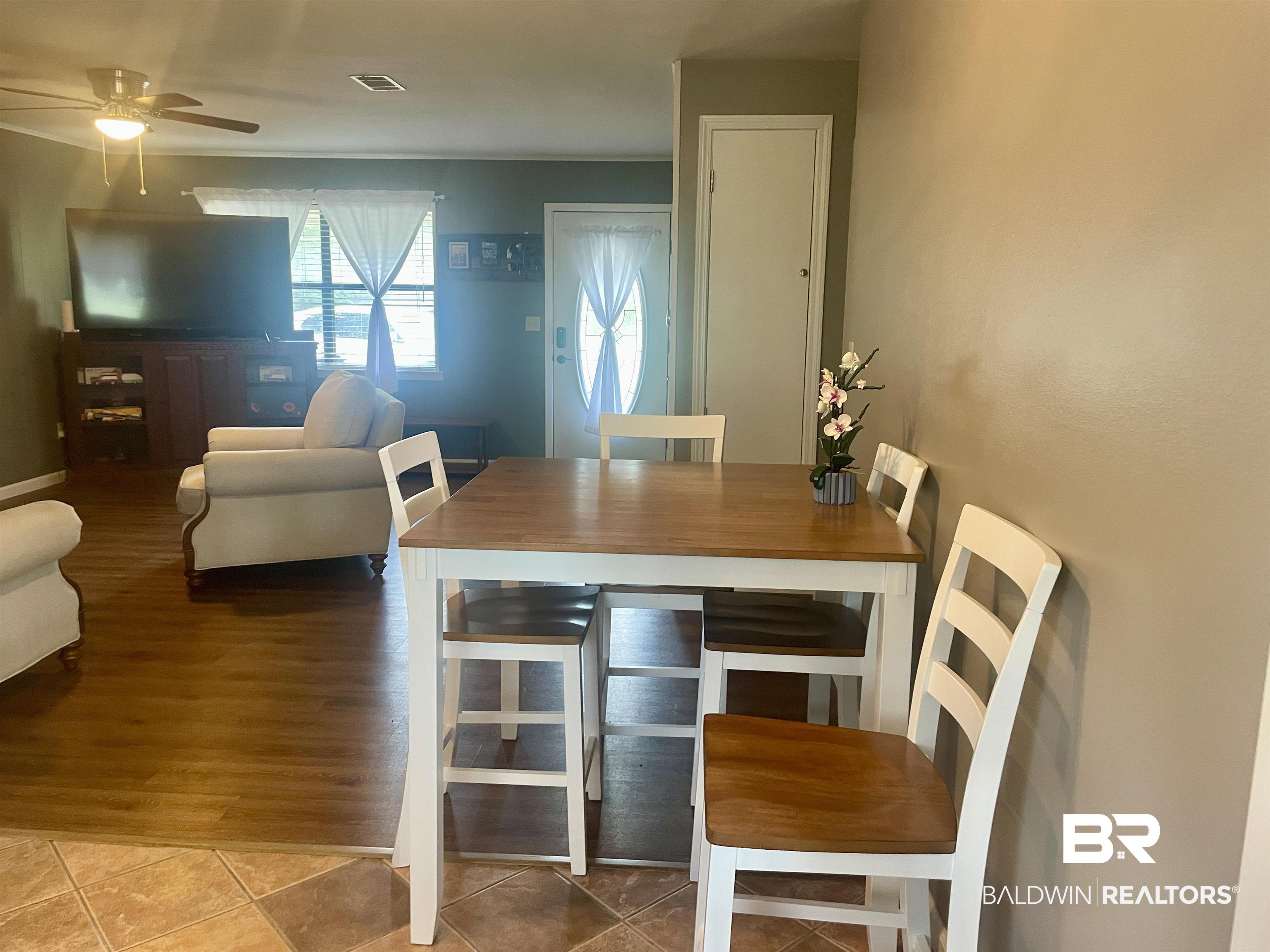 2274 Foshee Road Brewton, AL 36426 - Photo 8 of 23 Tiled dining space with a ceiling fan