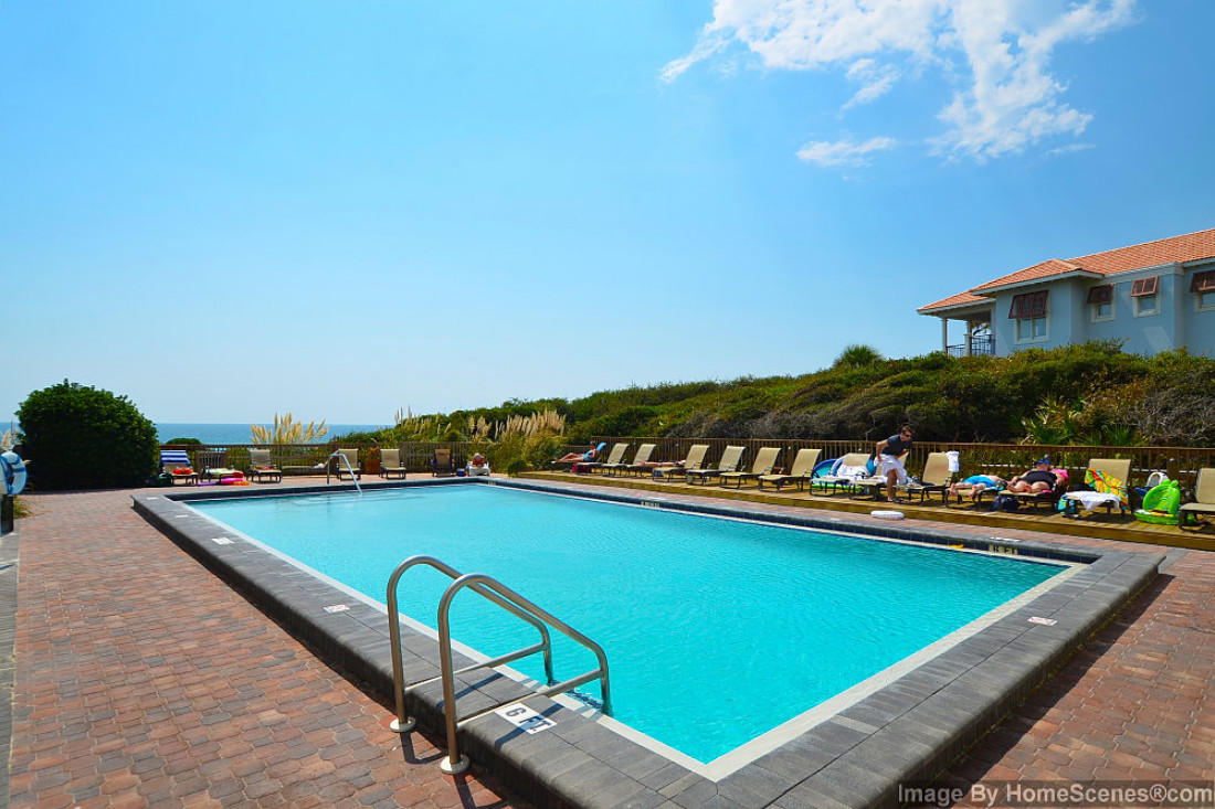 4100 East Scenic Highway, Unit 1307 Santa Rosa Beach, FL 32459 - Photo 23 of 28 a view of a swimming pool with a table and chairs