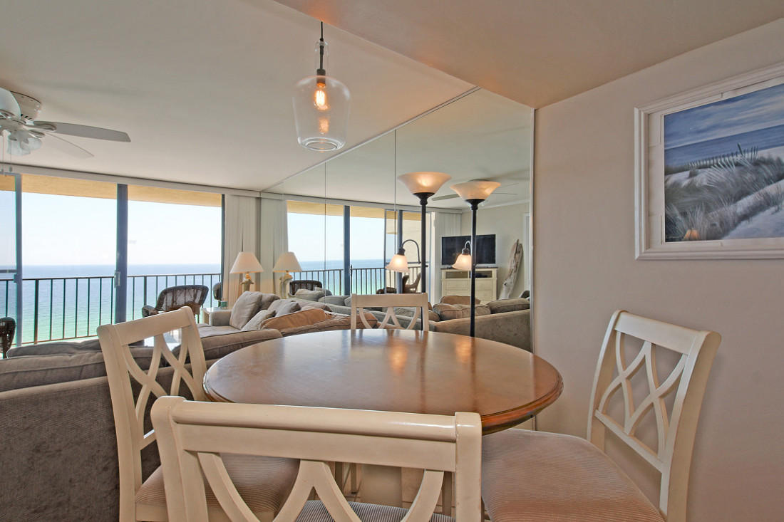 4100 East Scenic Highway, Unit 1307 Santa Rosa Beach, FL 32459 - Photo 6 of 28 a dining room with furniture a chandelier and wooden floor