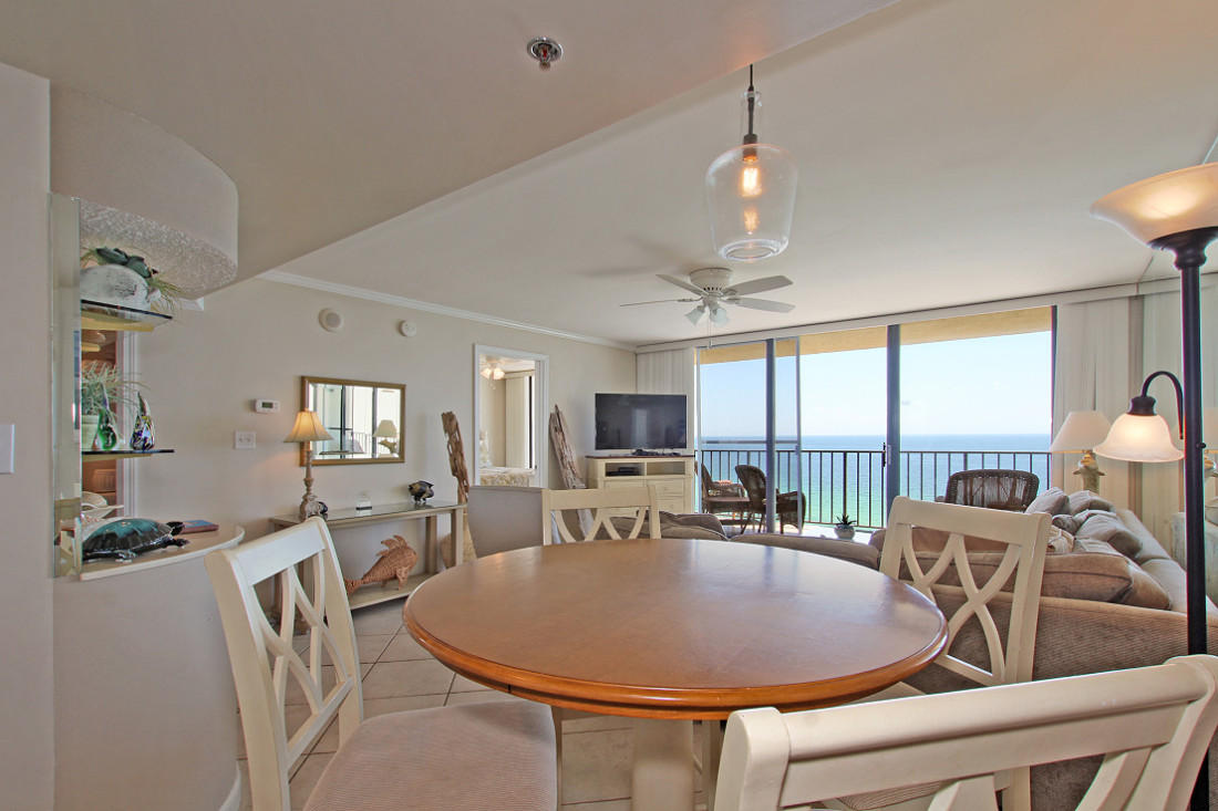 4100 East Scenic Highway, Unit 1307 Santa Rosa Beach, FL 32459 - Photo 7 of 28 a dining room with furniture a chandelier and window