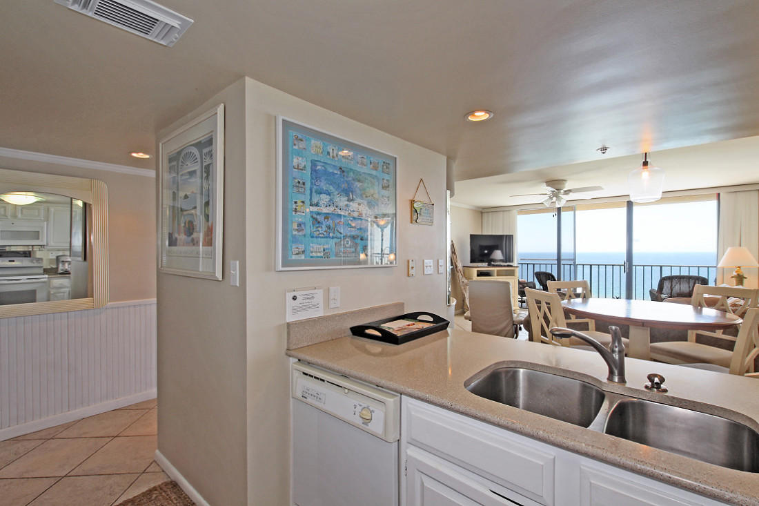 4100 East Scenic Highway, Unit 1307 Santa Rosa Beach, FL 32459 - Photo 10 of 28 a kitchen with a sink and a refrigerator
