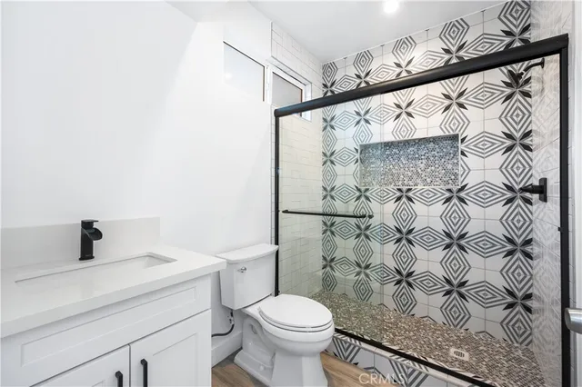 a bathroom with a toilet and a shower curtain