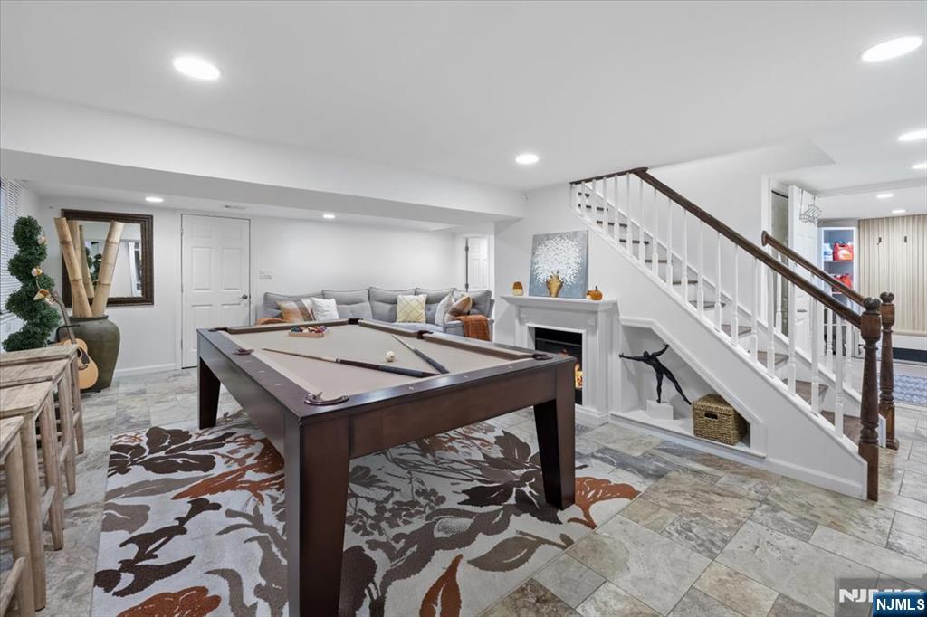 338 South Van Dien Avenue Ridgewood, NJ 07450 - Photo 25 of 33 a living room with a table and a rug