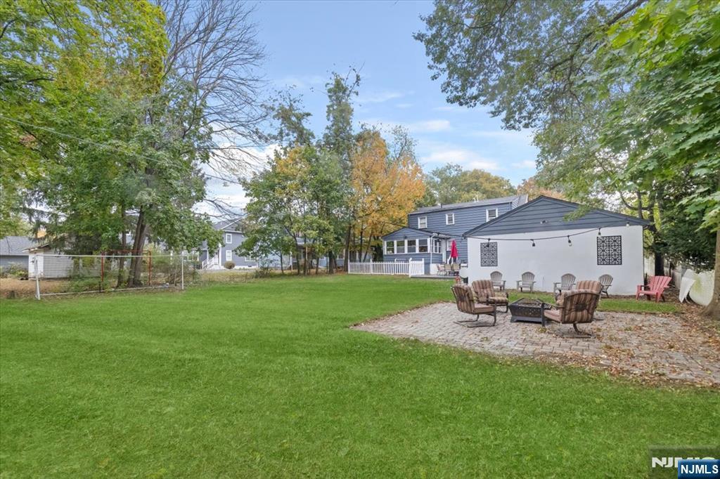 338 South Van Dien Avenue Ridgewood, NJ 07450 - Photo 29 of 33 a view of a house with backyard sitting area and garden