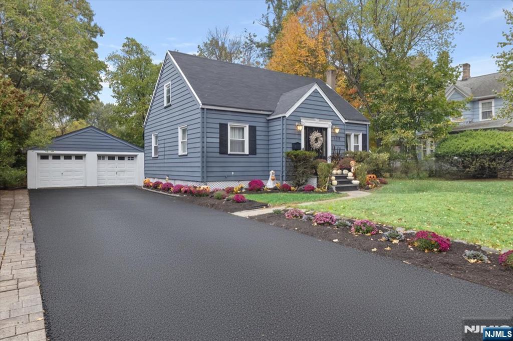 338 South Van Dien Avenue Ridgewood, NJ 07450 - Photo 31 of 33 a front view of a house with a yard and garage
