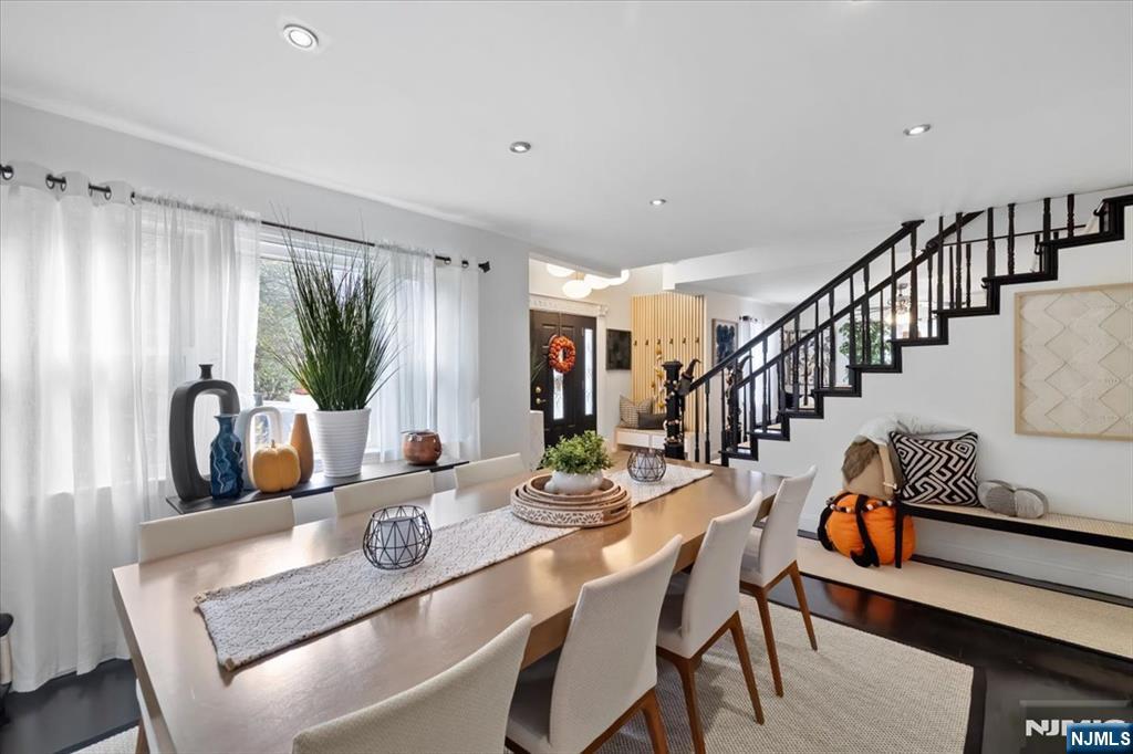 338 South Van Dien Avenue Ridgewood, NJ 07450 - Photo 10 of 33 a dining room with furniture a rug and wooden floor