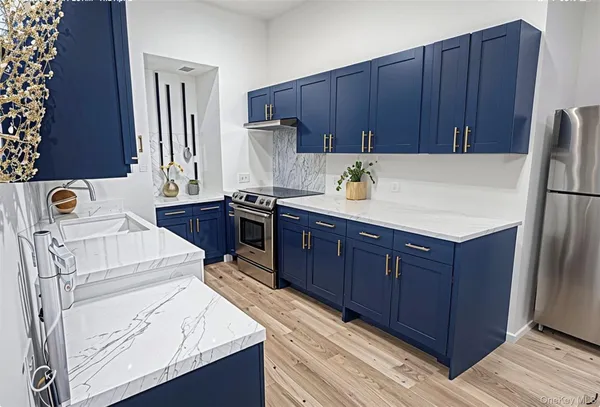 a kitchen with a cabinets and white appliances