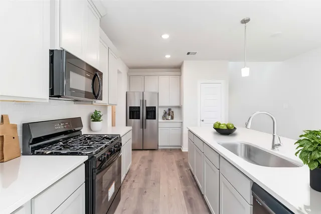 a bathroom with a shower and a sink