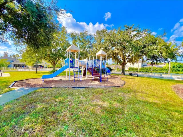 a view of a park with large trees