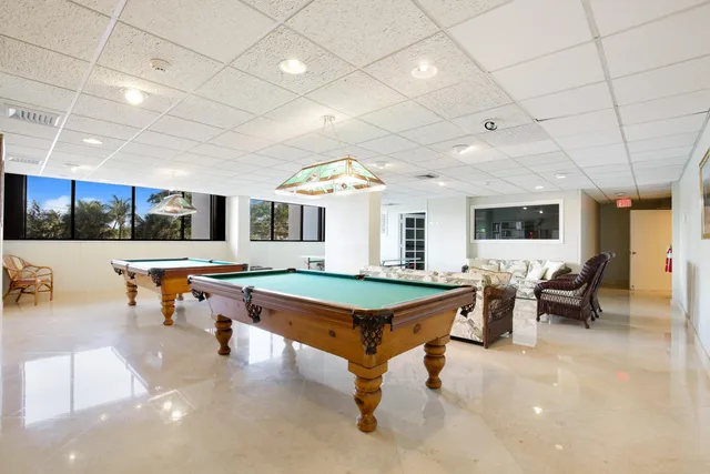 a room with lots of furniture and windows