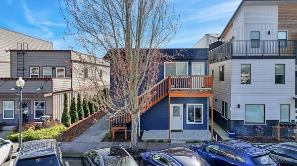 a front view of a building with chairs