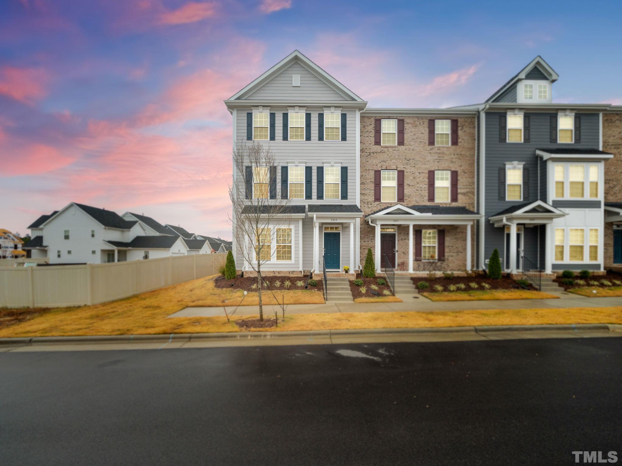 a view of a house with swimming pool next to a yard