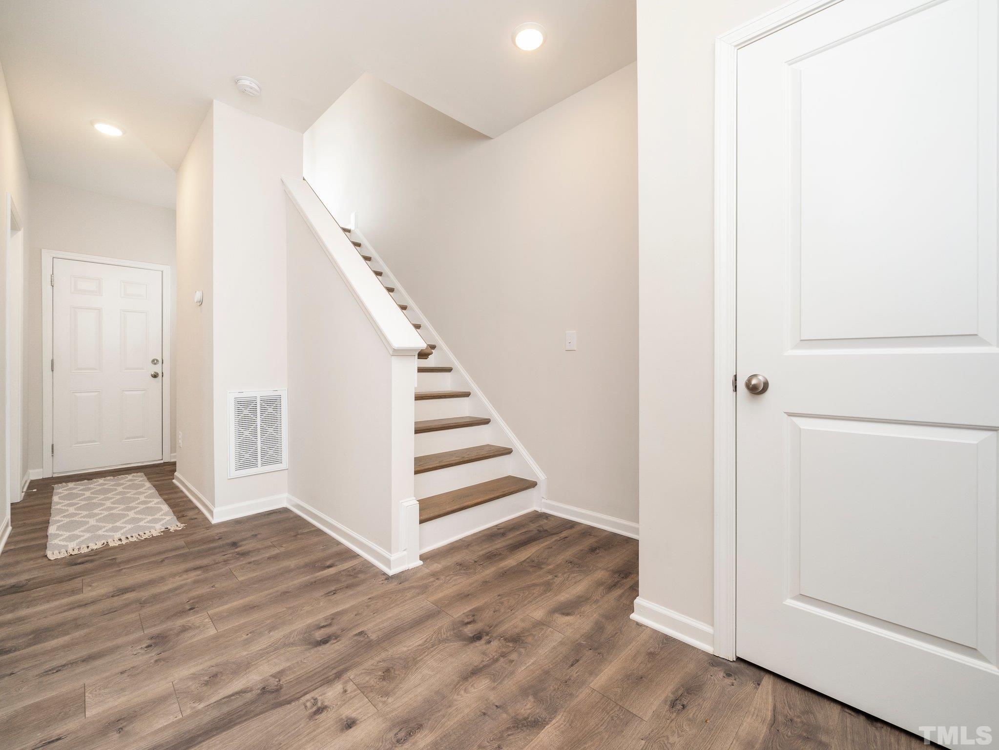 5915 Kayton Street Raleigh, NC 27616 - Photo 13 of 26 a view of entryway with wooden floor