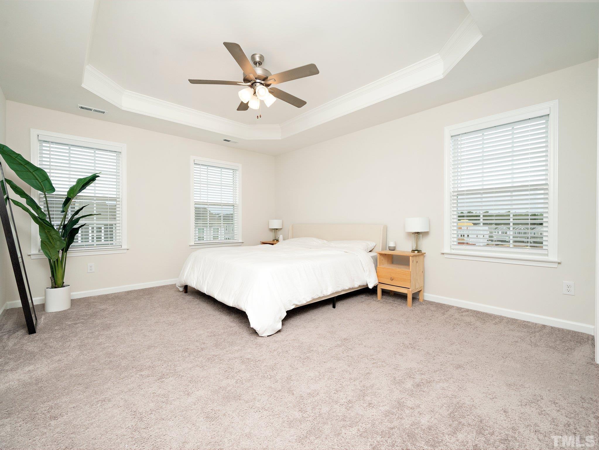5915 Kayton Street Raleigh, NC 27616 - Photo 14 of 26 a bedroom with a bed and a window
