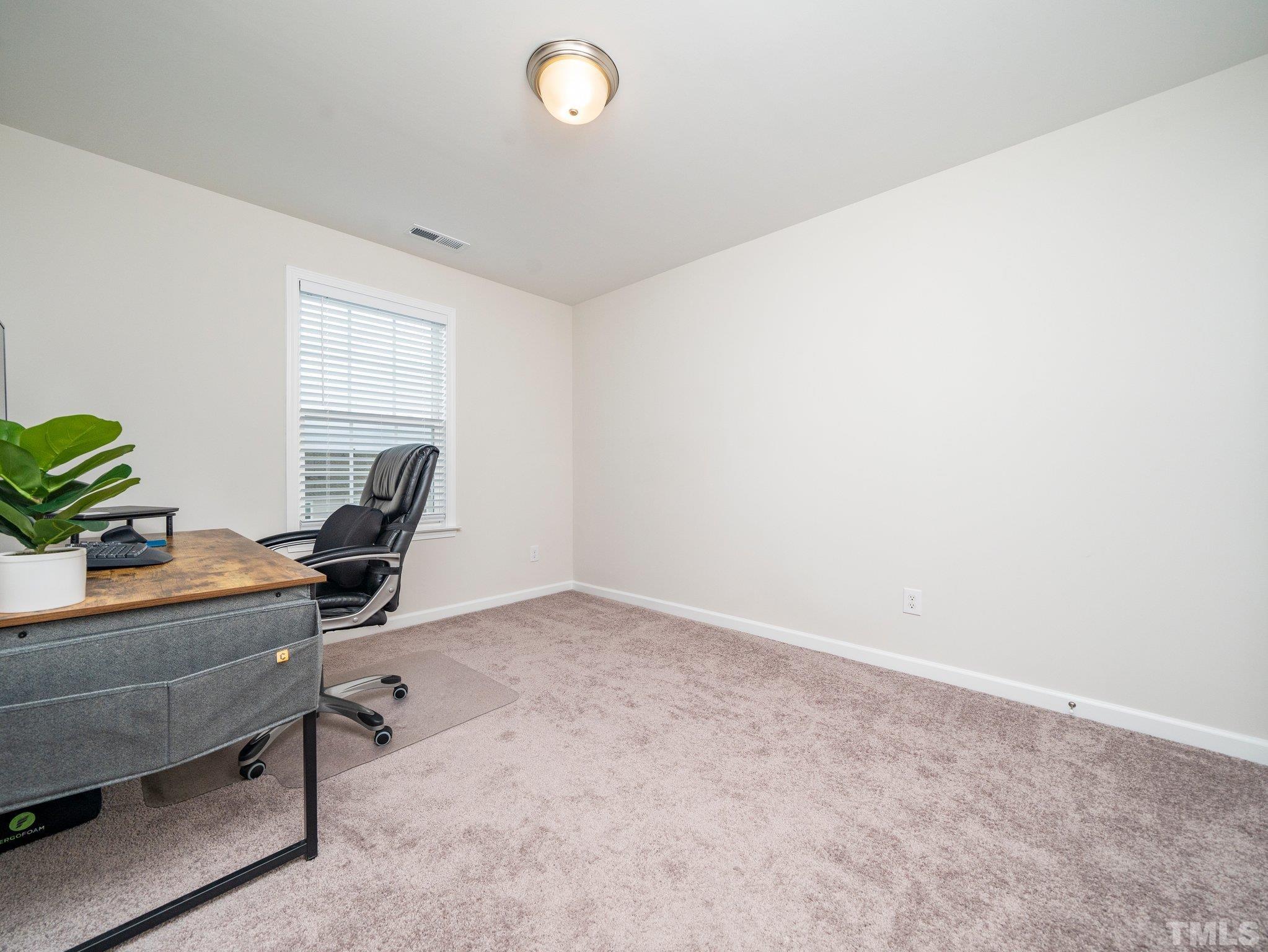 5915 Kayton Street Raleigh, NC 27616 - Photo 19 of 26 a view of a workspace with furniture