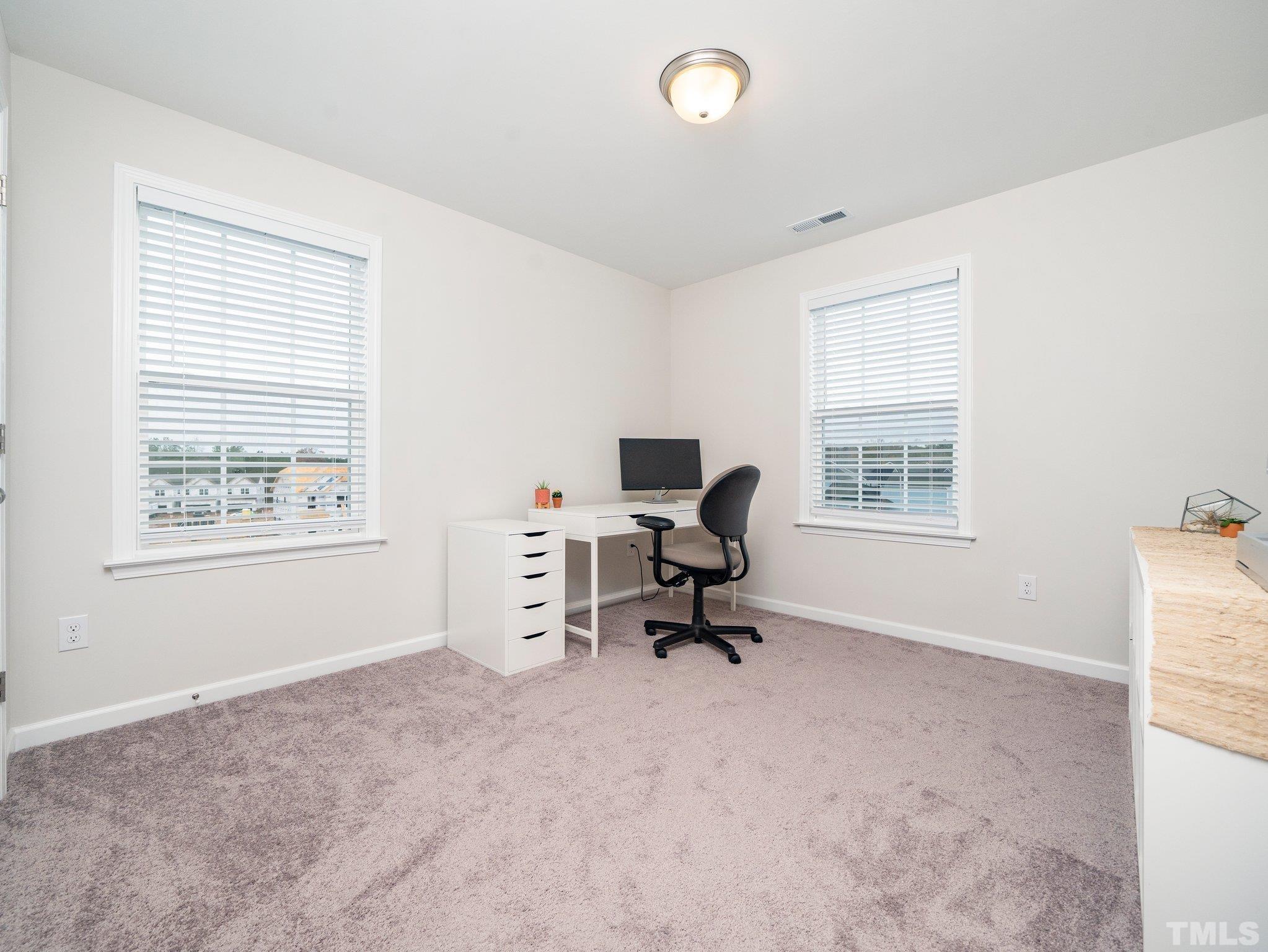5915 Kayton Street Raleigh, NC 27616 - Photo 20 of 26 a view of a workspace with a window