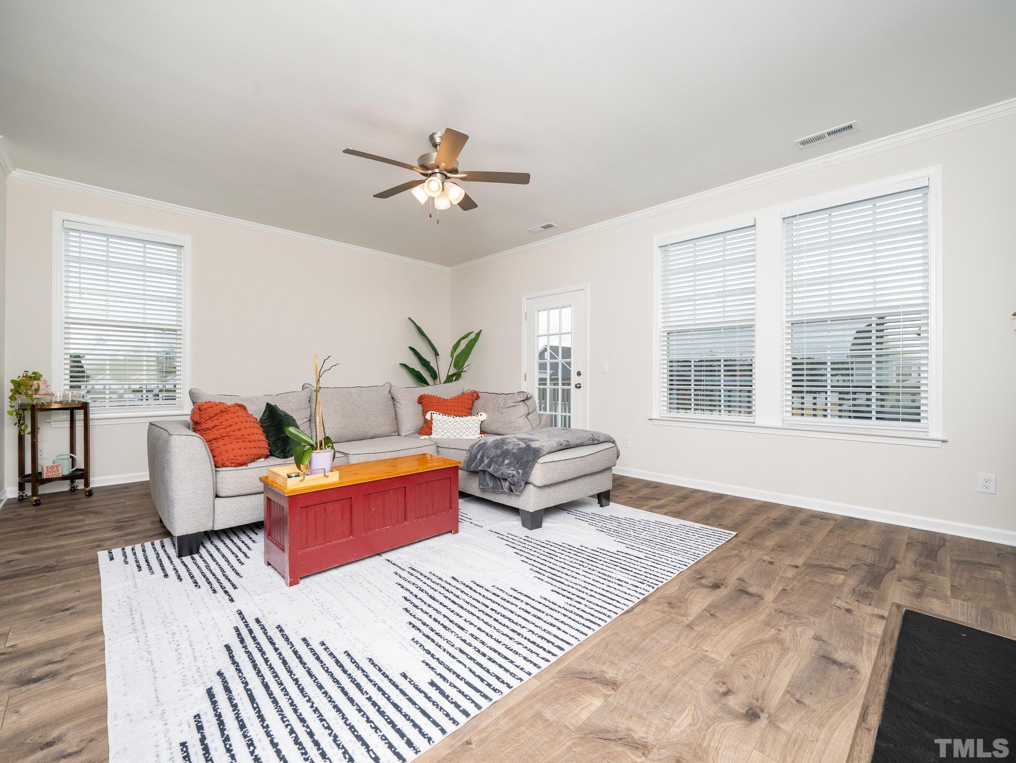 5915 Kayton Street Raleigh, NC 27616 - Photo 6 of 26 a living room with furniture and wooden floor