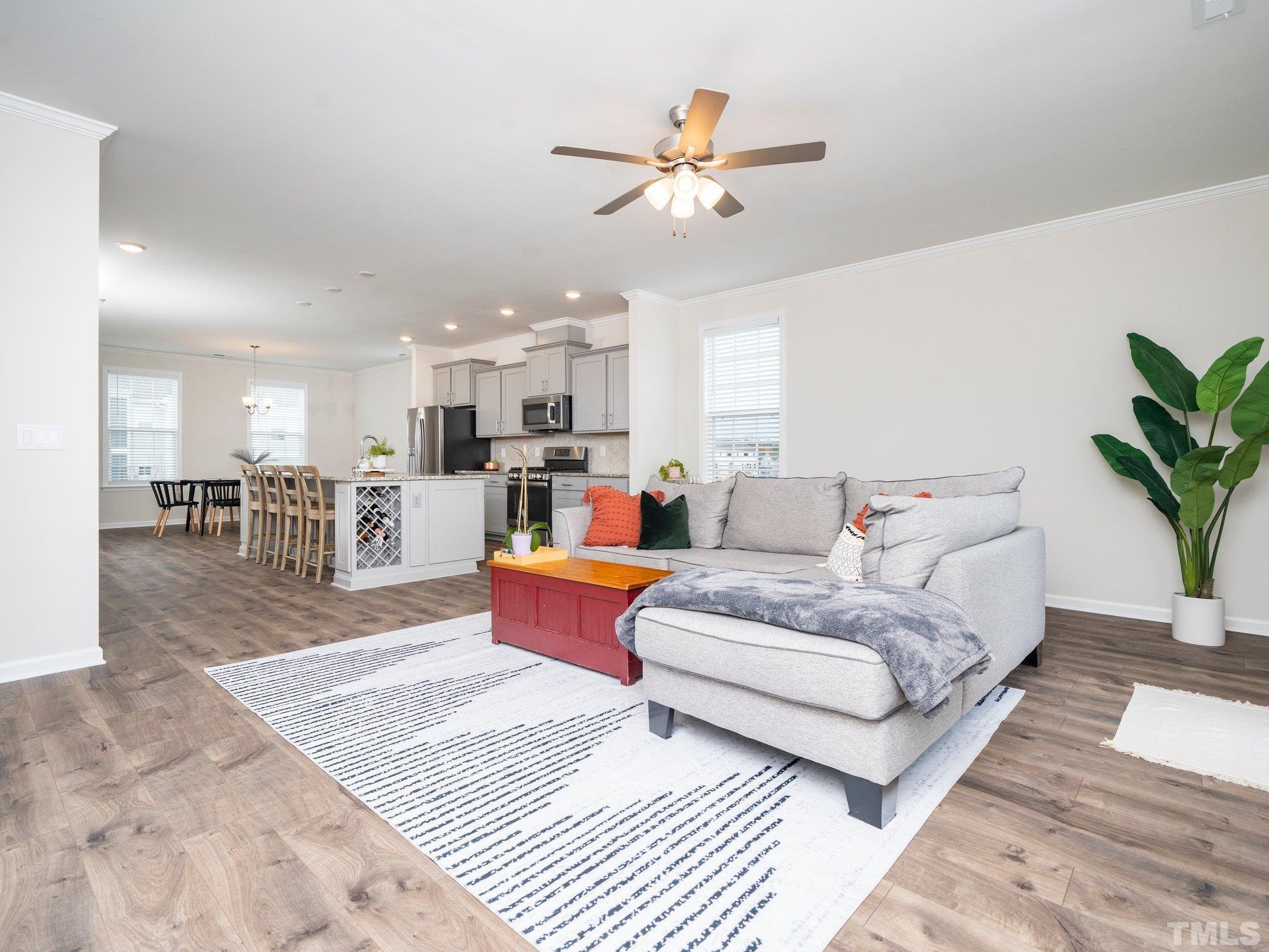 5915 Kayton Street Raleigh, NC 27616 - Photo 9 of 26 a living room with furniture and kitchen view