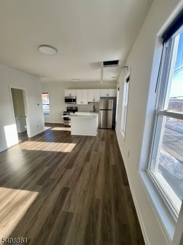 a view of a living room with a fireplace