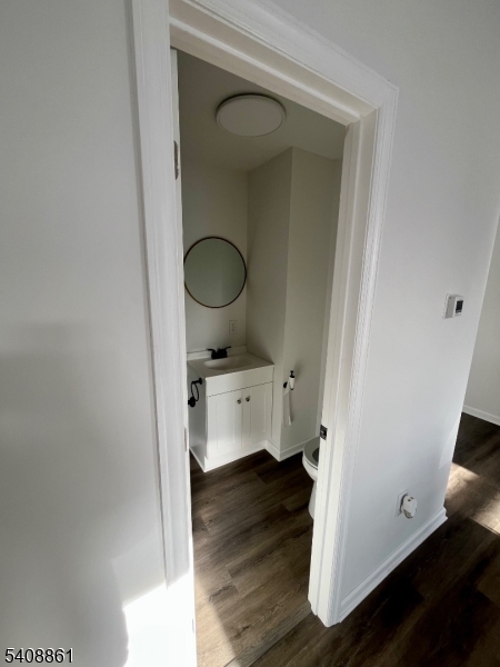 53 High Street, Unit A Newton, NJ 07860 - Photo 9 of 13 a view of bathroom with a toilet a sink and a mirror