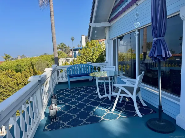a view of balcony with chairs