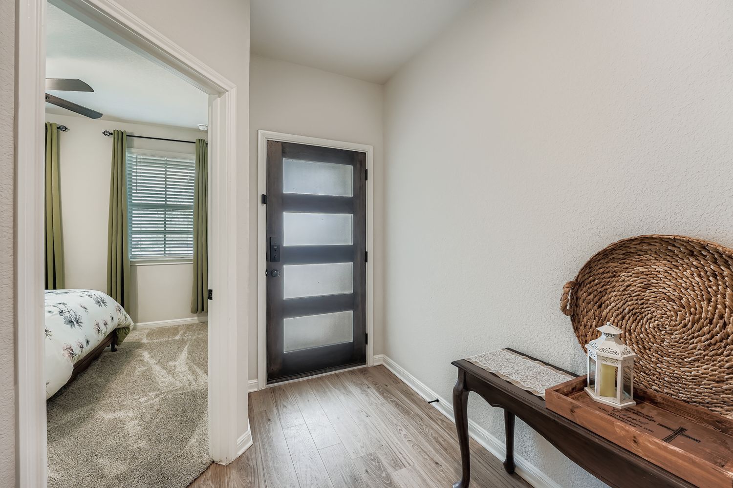 148 Gullivers Drive Elgin, TX 78621 - Photo 3 of 21 Entrance foyer featuring light wood-style floors and baseboards
