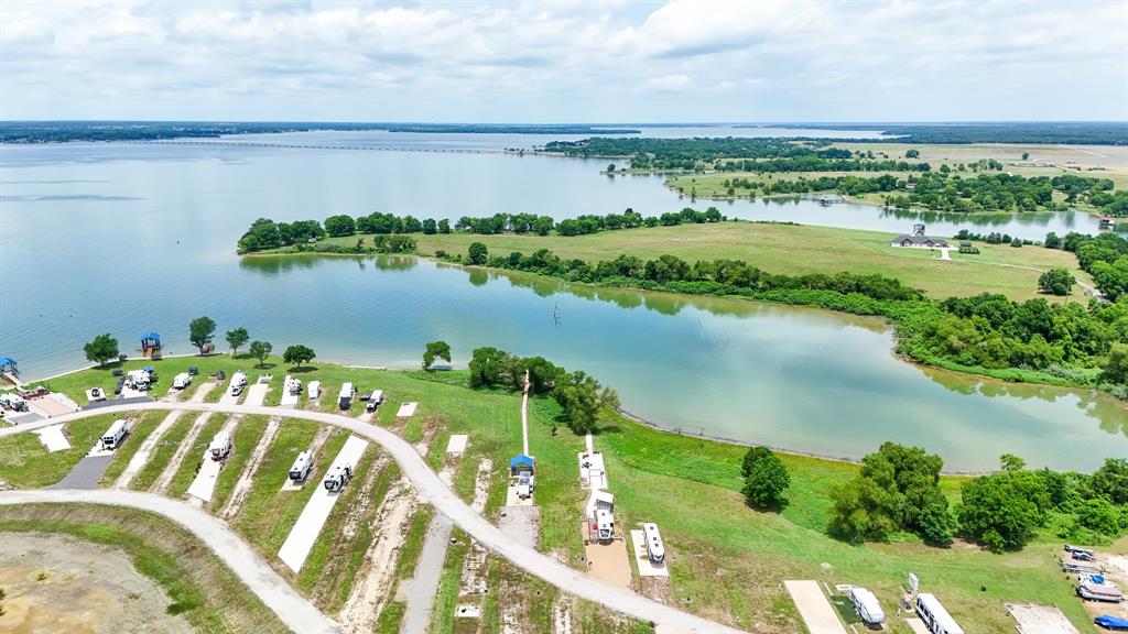 5096 Waterfront Road Kerens, TX 75144 - Photo 5 of 11 a view of a lake with a houses
