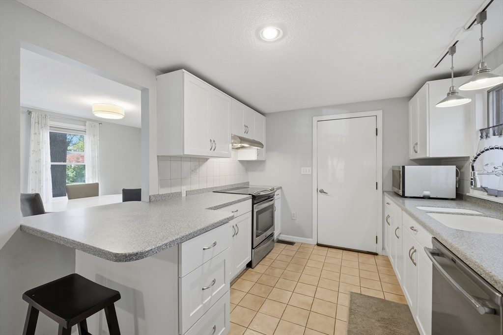 5 Ferncroft Street Longmeadow, MA 01106 - Photo 12 of 40 a kitchen with granite countertop a sink stove and refrigerator