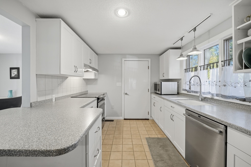 5 Ferncroft Street Longmeadow, MA 01106 - Photo 13 of 40 a kitchen with stainless steel appliances granite countertop a sink and cabinets