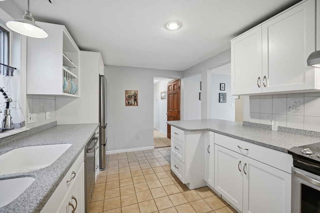 5 Ferncroft Street Longmeadow, MA 01106 - Photo 14 of 40 a kitchen with a sink stove and cabinets