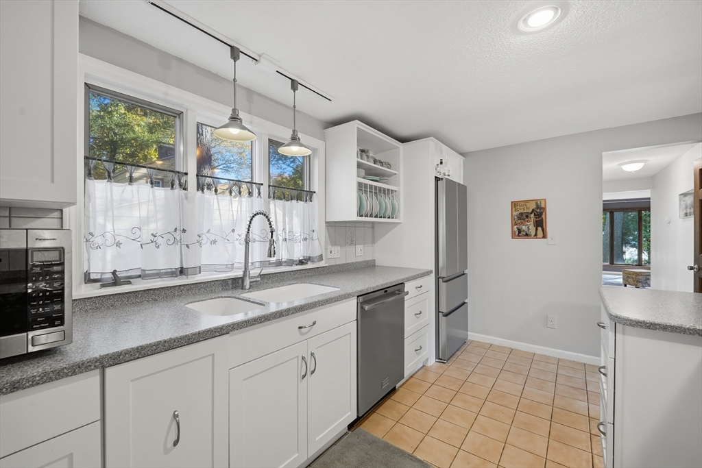 5 Ferncroft Street Longmeadow, MA 01106 - Photo 15 of 40 a kitchen with granite countertop a sink stainless steel appliances and cabinets